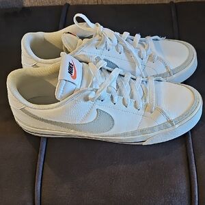Nike White Low-Top Sneakers with Gray Swoosh and Orange Logo